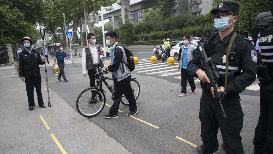 العمل على فحص جميع سكان ووهان الصينية بسبب اكتشاف حالات جديدة بالمدينة